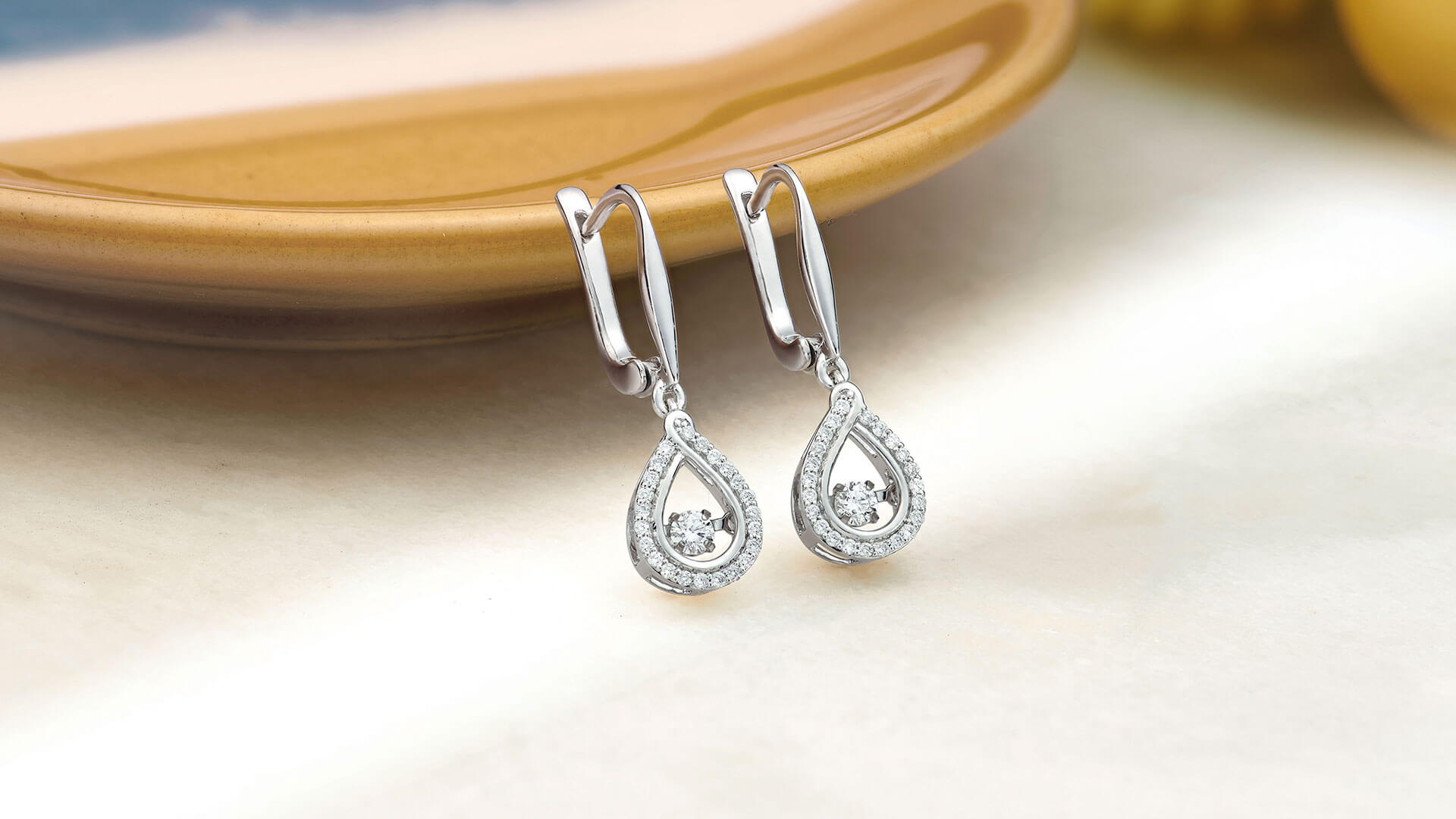 A pair of Dance 9ct White Gold Diamond Drop Earrings by Beaverbrooks