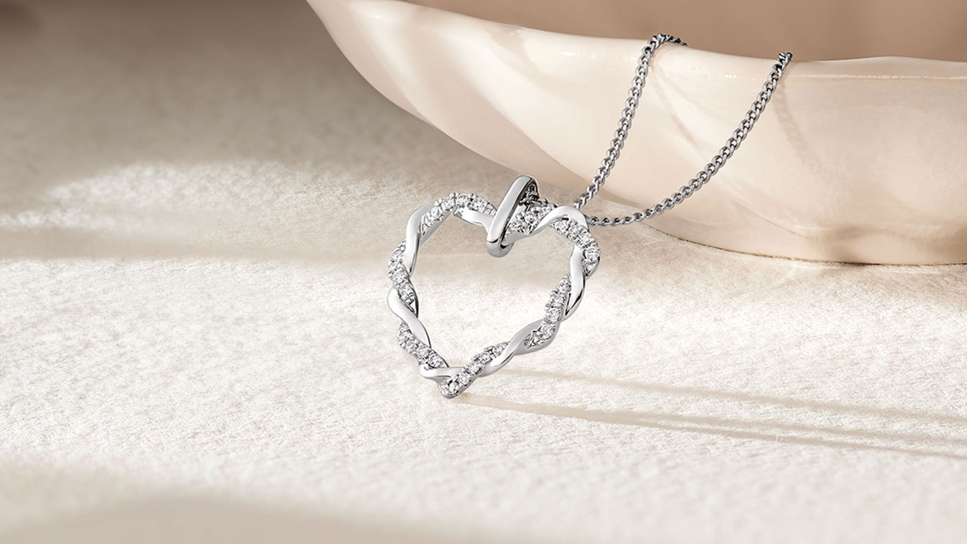 An Entwine 9ct White Gold Diamond Heart Pendant