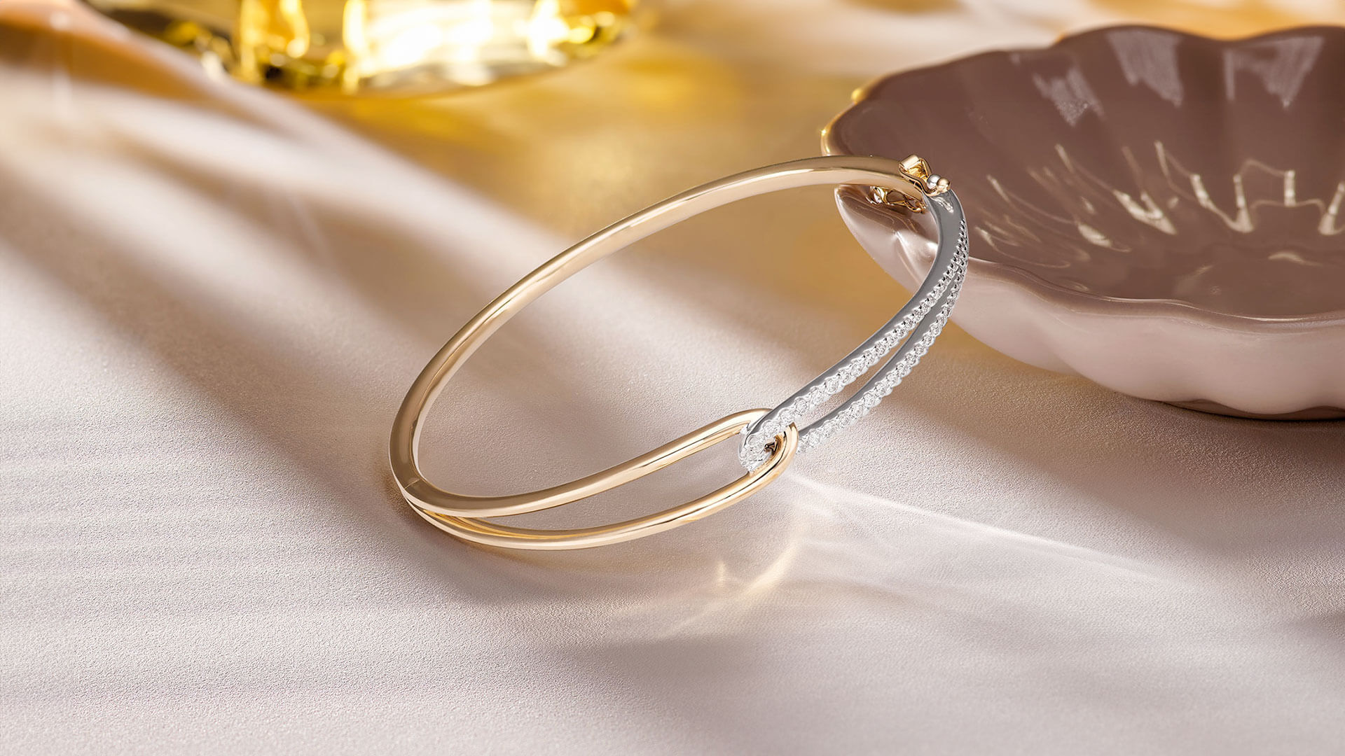 An Essence by Beaverbrooks 9ct Yellow Gold Diamond Bangle