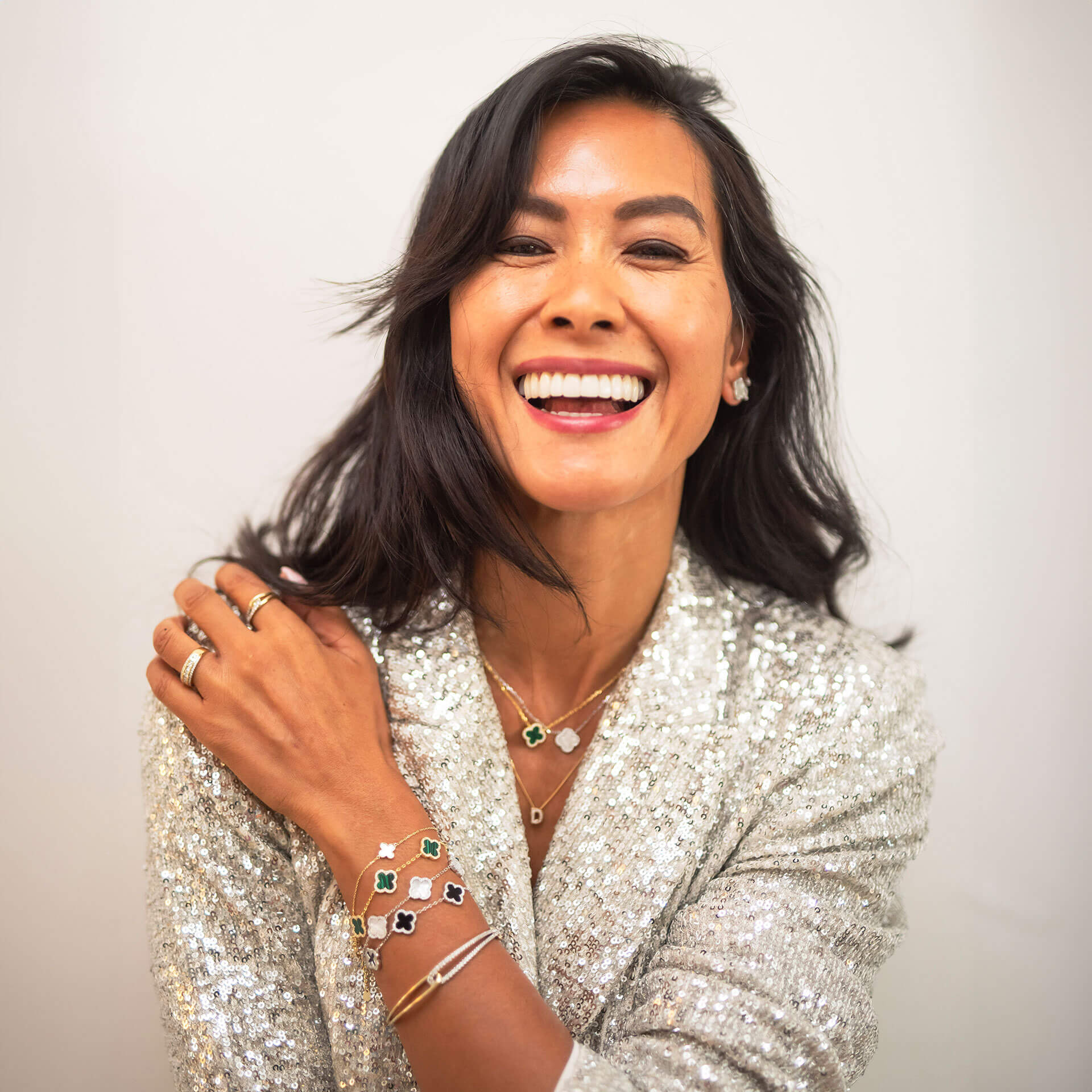 Debbie Le Grainger, Beaverbrooks Ambassador, wearing multiple pieces of sparkling on trend Beaverbrooks jewellery and sporting a dazzling smile.